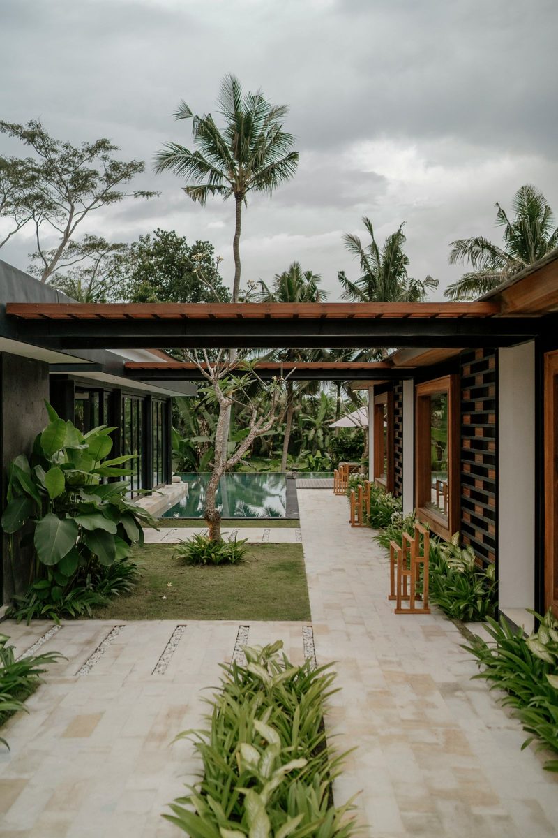 Secure private villa courtyard in Bali with tropical greenery and pool access