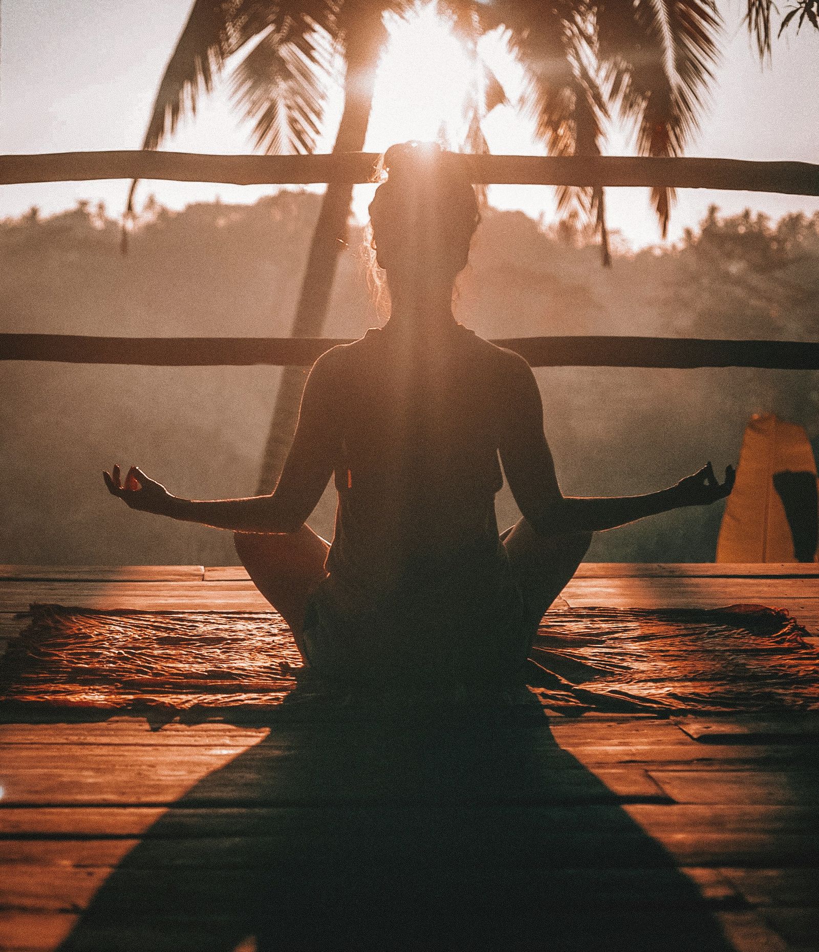 A person meditating in a jungle yoga studio in Ubud Bali