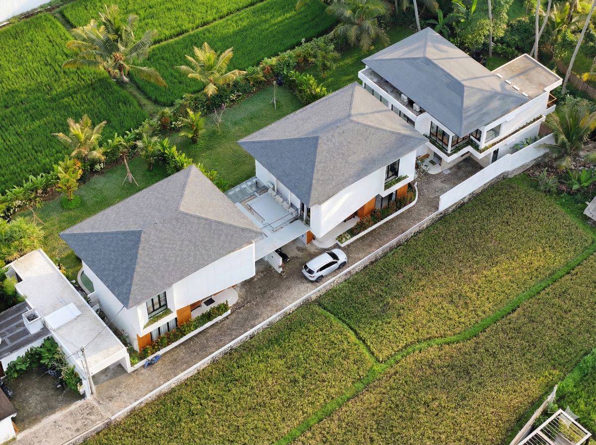 Drone view of all three Hubuddha Villas surrounded by rice fields, Ubud Bali