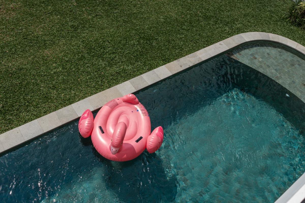 Child on a pool floatie at Hubuddha Villas, Ubud Bali