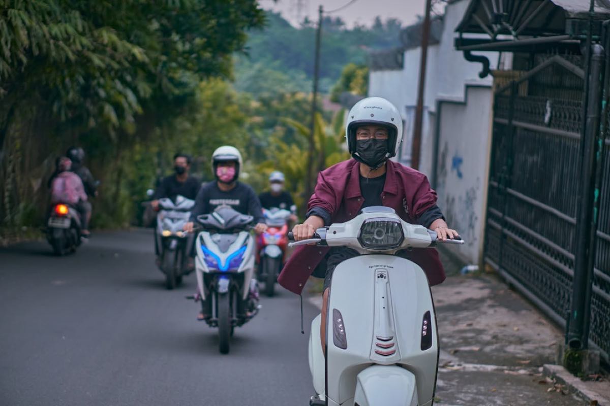 Scooters on a tropical road in Ubud, Bali