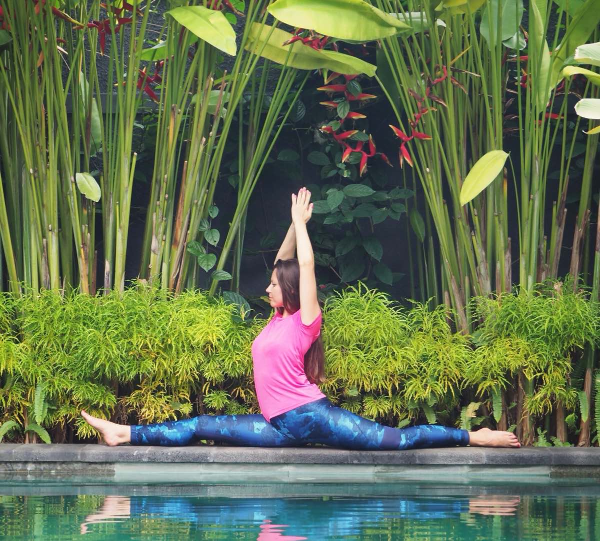 Woman meditating peacefully in a tropical forest