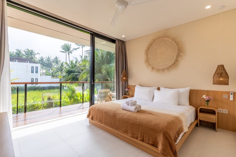 Villa bedroom with rice field views