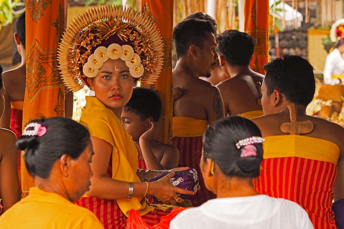Bali temple with traditional offerings and ceremony
